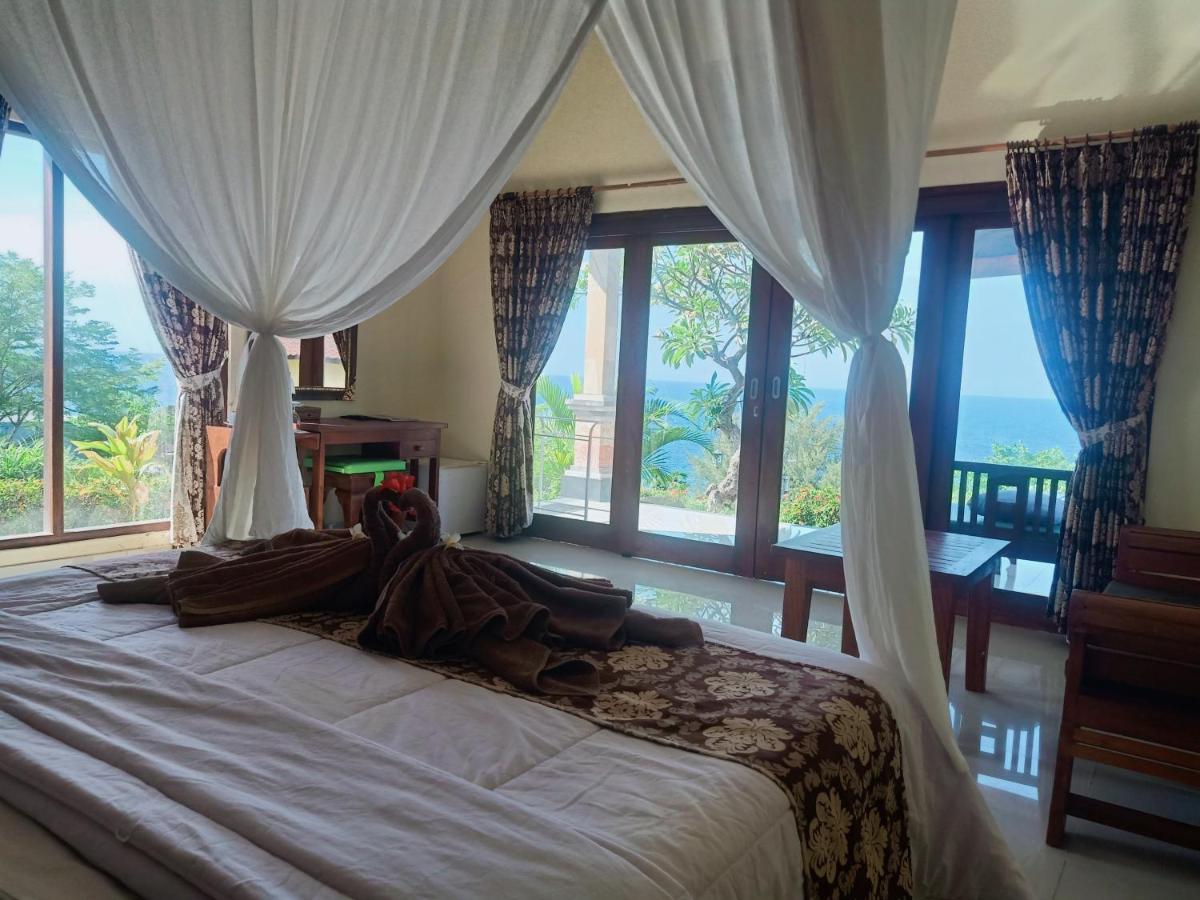 Canopy bed inside a villa at Bali Bhuana Villas